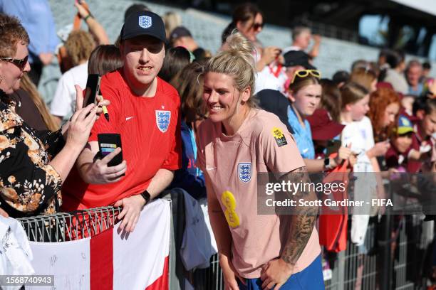 Millie Bright of England takes a photo with a fan during an England Training Session on July 25, 2023 in Central Coast, Australia.