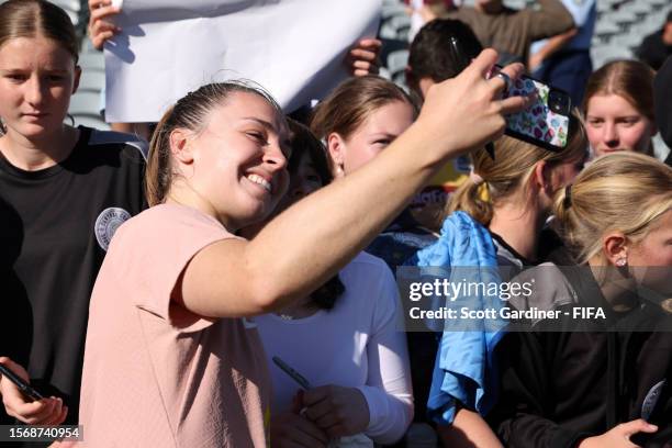 Niamh Charles of England takes a selfie with a fan during an England Training Session on July 25, 2023 in Central Coast, Australia.