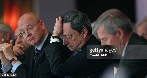 Mario Draghi, President of the European Central Bank ECB , Martin Blessing, CEO of the Commerzbank and Juergen Fitschen CEO of the Deutsche Bank...