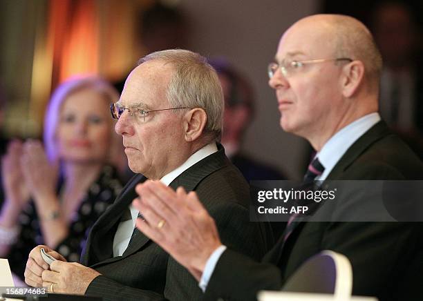 German Finance Minister Wolfgang Schaeuble and German CEO of the Commerzbank, Martin Blessing react during the European Banking Congress EBC in...