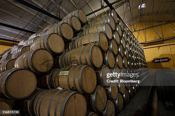 Barrels of Jose Cuervo tequila sit stacked in the cellar of the Tequila Cuervo La Rojena S.A. De C.V. Distillery plant in Guadalajara, Mexico, on...