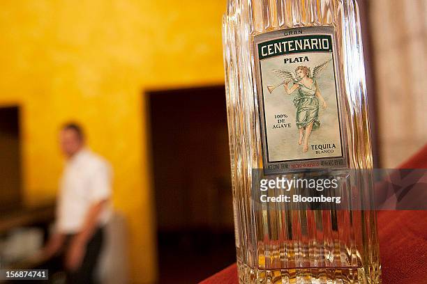 Bottle of Centenario silver tequila is arranged for a photograph on a bar at the Tequila Cuervo La Rojena S.A. De C.V., maker of Jose Cuervo,...