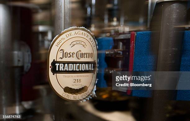 The label for a bottle of Jose Cuervo Tradicional moves along the production line at the Tequila Cuervo La Rojena S.A. De C.V. Bottling factory in...