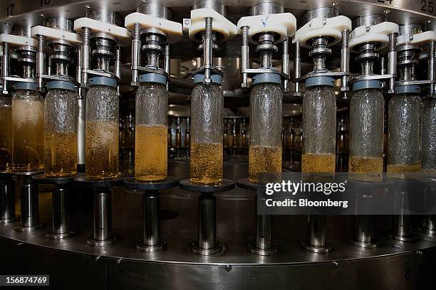 Machine fills empty bottles with Jose Cuervo Tradicional tequila on the production line at the Tequila Cuervo La Rojena S.A. De C.V. Bottling factory...