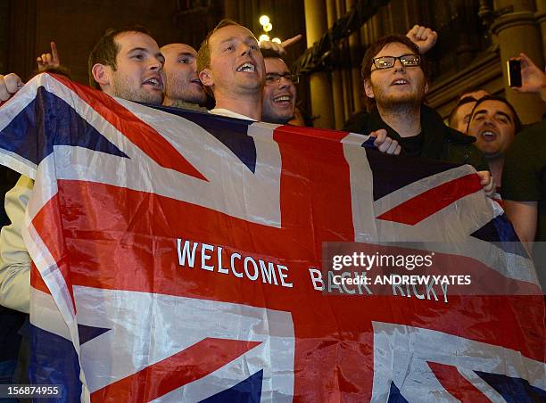 Fans of British boxer Ricky Hatton cheer during the weigh-in at the Town Hall in Manchester, north-west England, on November 23 on the eve of his...