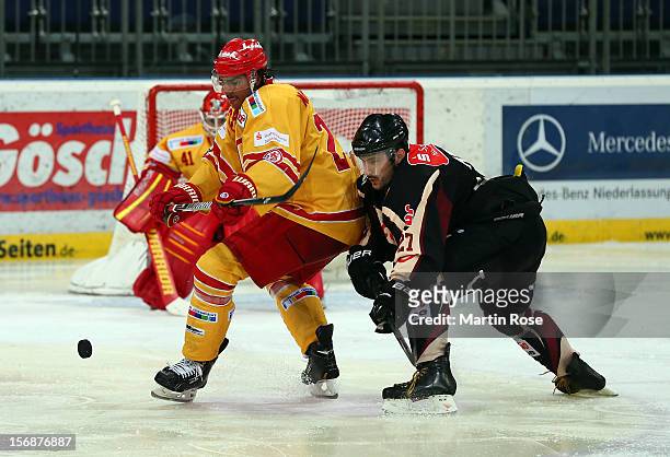 Ivan Ciernik of Hannover and Andreas Martinsen of Duesseldorf battle for the puck during the DEL match between Hannover Scorpions and Duesseldorfer...