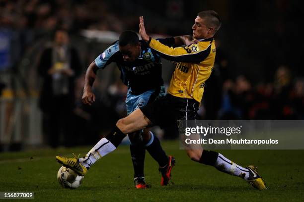 Danny Verbeek of NAC and Rydell Poepon of Den Haag battle for the ball during the Eredivisie match between NAC Breda and ADO Den Haag at the Rat...