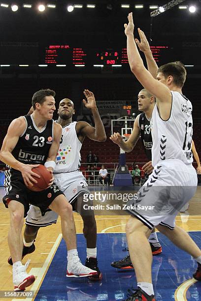 Casey Jacobson of Brose Baskets Bamberg competes with Gasper Vidmar and Christopher Patrick of Besiktas Jk Istanbul during the 2012-2013 Turkish...