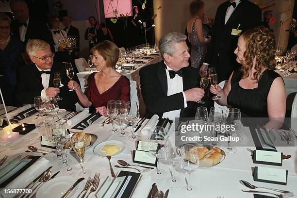 German President Joachim Gauck and his partner Daniela Schadt toast with Bundespresseball Chairman Gregor Mayntz and his wife Sonja Mayntz at the...