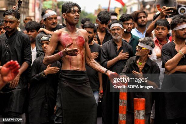 Shia Muslim takes part during a Muharram procession. Muharram is the first month of the Islamic calendar & Ashura is the tenth day of the month of...