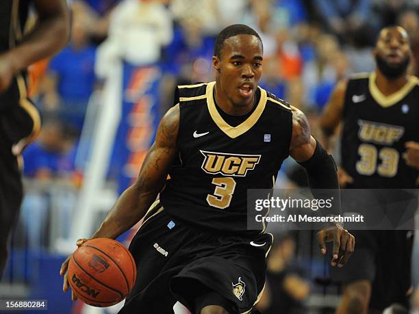 Guard Isaiah Sykes of the Central Florida Knights drives up court against the Florida Gators November 23, 2012 at Stephen C. O'Connell Center in...