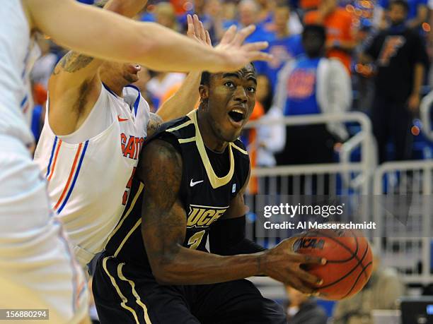 Guard Isaiah Sykes of the Central Florida Knights drives to the basket against the Florida Gators November 23, 2012 at Stephen C. O'Connell Center in...