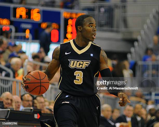 Guard Isaiah Sykes of the Central Florida Knights drives up court against the Florida Gators November 23, 2012 at Stephen C. O'Connell Center in...