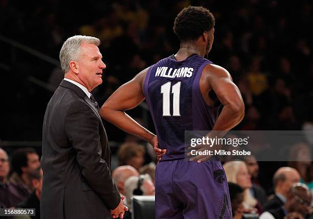 Head Coach Bruce Weber of Kansas State Wildcats speaks with Nino Williams during the game against the Michigan Wolverines at Madison Square Garden on...
