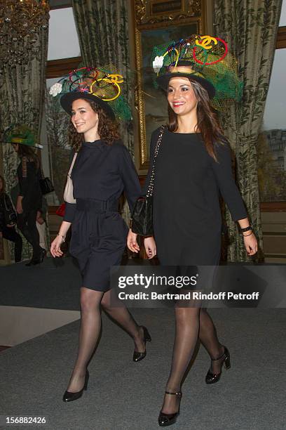 Young employees of the Chanel fashion house parade at the Paris City Hall during the Sainte-Catherine Celebration on November 23, 2012 in Paris,...