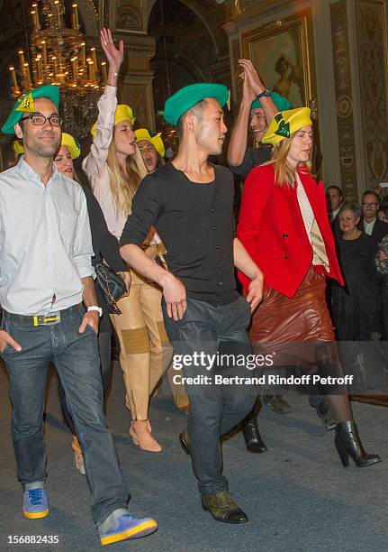 Young employees of the Chloe fashion house parade at the Paris City Hall during the Sainte-Catherine Celebration on November 23, 2012 in Paris,...