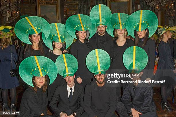 Young employees of the Givenchy fashion house pose at the Paris City Hall during the Sainte-Catherine Celebration on November 23, 2012 in Paris,...