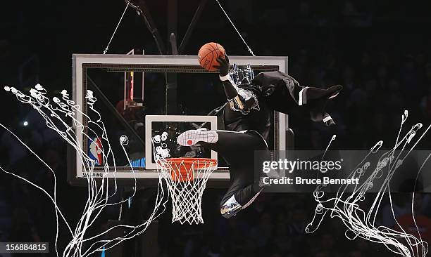 The mascot for the Brooklyn Nets, the BrooklyKnight flies in to score two during a break in the game between the Brooklyn Nets and the Los Angeles...