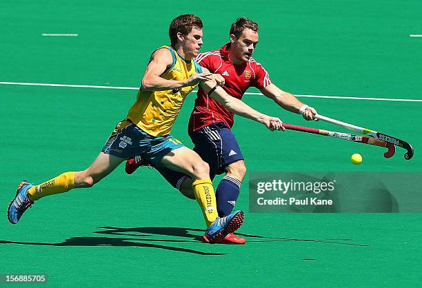 Tristan White of the Kookaburras and Barry Middleton of England contest for the ball in the mens Australia Kookaburras v England game during day...