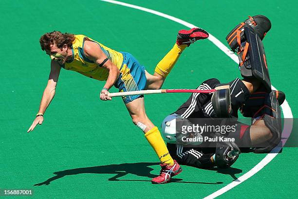 Jacob Whetton of the Kookaburras collides with George Pinner of England in the mens Australia Kookaburras v England game during day three of the 2012...