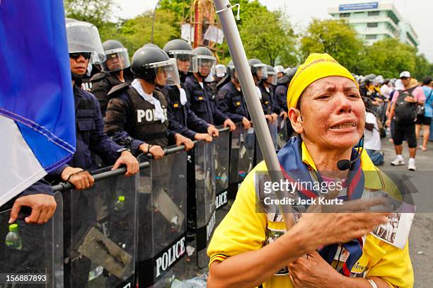 Thai woman professes her love for Bhumibol Adulyadej, the King of Thailand, in front of riot police during a large anti government protest on...