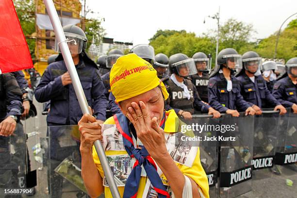 Thai woman professes her love for Bhumibol Adulyadej, the King of Thailand, in front of riot police during a large anti government protest on...