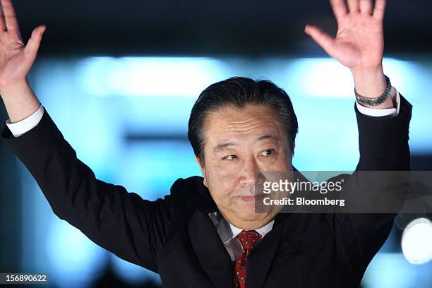 Yoshihiko Noda, Japan's prime minister and president of the Democratic Party of Japan , waves during a campaign rally for the Dec. 16 general...