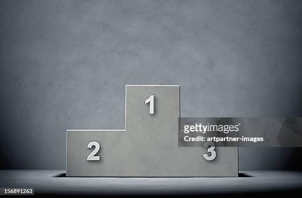 concrete winners podium on a concrete background - winners podium foto e immagini stock