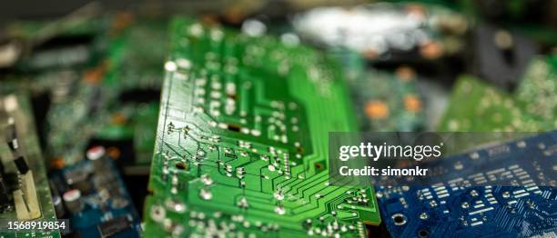 computer chips on desk - e waste stock pictures, royalty-free photos & images