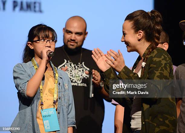 Young girl performs with Malikah at the Express Yourself Family Day Panel at the Katara Opera House during the 2012 Doha Tribeca Film Festival on...