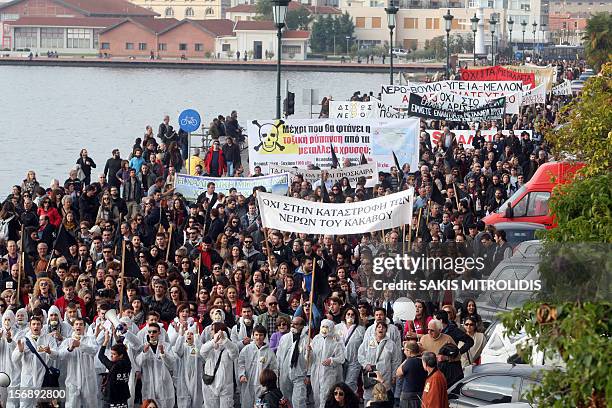 Demonstrators shout slogans as they march in Thessaloniki on November 24 during a protest against efforts by Hellenic Gold, a subsidiary of the...