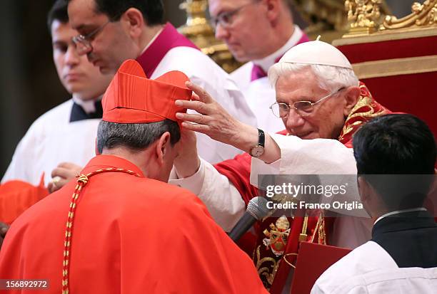 New cardinal, Ruben Salazar Gomez, archbishop of Bogotˆ, receives the biretta cap from Pope Benedict XVI in Saint Peter's Basilica on November 24,...