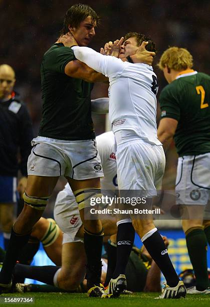 Ben Youngs clashes with Eben Etzebeth of South Africa during the QBE International match between England and South Africa at Twickenham Stadium on...