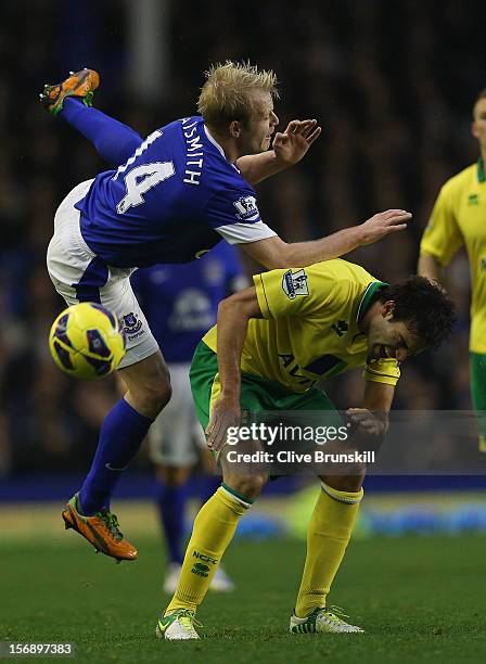 Steven Naismith of Everton clashes with Javier Garrido of Norwich City during the Barclays Premier League match between Everton and Norwich City at...