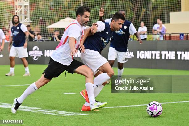 Juan Pablo Angel of Colombia and Marcelo Saragosa of Brazil battle for possession during the Premier League Summer Series Legends 5v5 at Universal...