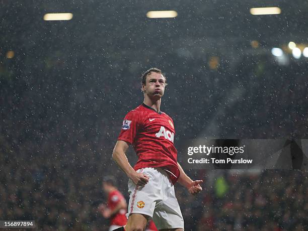 Jonny Evans of Manchester United celebrates scoring their first goal during the Barclays Premier League match between Manchester United and Queens...