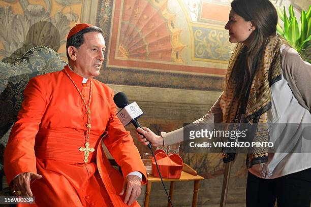 Colombia's cardinal Ruben Salazar Gomez speaks to a journalist during the courtesy visit after being appointed by the pontif on November 24, 2012 at...