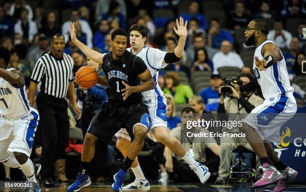 Doug McDermott of the Creighton Bluejays guards Joshua Clyburn of the Presbyterian Blue Hose during their game at CenturyLink Center on November 18,...