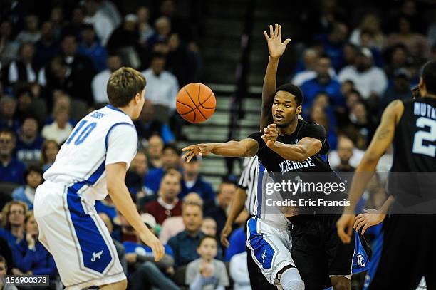 Joshua Clyburn of the Presbyterian Blue Hose passes the ball past Grant Gibbs of the Creighton Bluejays during their game at CenturyLink Center on...