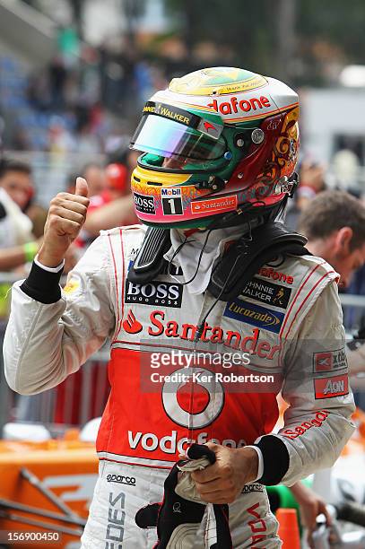 Lewis Hamilton of Great Britain and McLaren celebrates finishing first during qualifying for the Brazilian Formula One Grand Prix at the Autodromo...