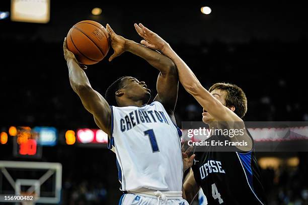 Austin Chatman of the Creighton Bluejays looks for a shot over Austin Anderson of the Presbyterian Blue Hose during their game at CenturyLink Center...