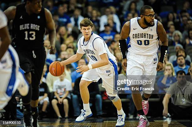 Grant Gibbs of the Creighton Bluejays brings the ball up court against the Presbyterian Blue Hose during their game at CenturyLink Center on November...