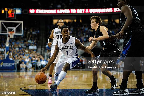 Austin Chatman of the Creighton Bluejays dribbles through the Presbyterian Blue Hose during their game at CenturyLink Center on November 18, 2012 in...