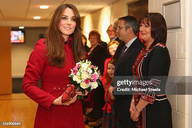 Catherine, Duchess of Cambridge holds a bouquet of flowers as she arrives at the Autumn International rugby match between Wales and New Zealand at...