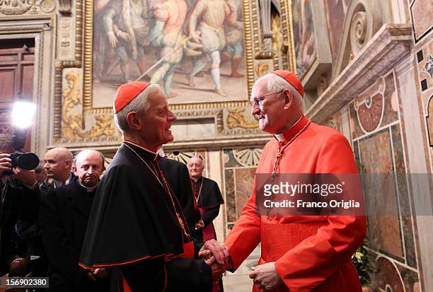 Newly appointed cardinal James M. Harvey receives congratulations from Archbishop of Washington Cardinal Donald Wuerl during the courtesy visits at...