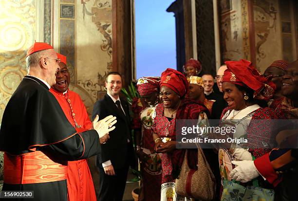 Vatican secretary of State cardinal Tarcisio Bertone poses with newly appointed cardinal John Olorunfemi Onaiyekan , archbishop of Abuja Nigeria, and...