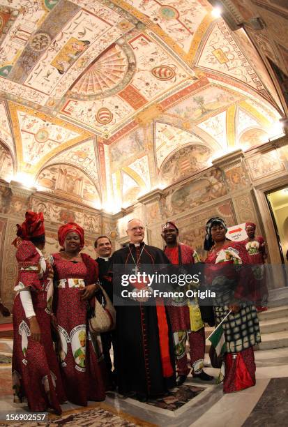 Archbishop of Sao Paulo Odilo Scherer poses with diocesans of the newly appointed cardinal John Olorunfemi Onaiyekan, archbishop of Abuja Nigeria,...