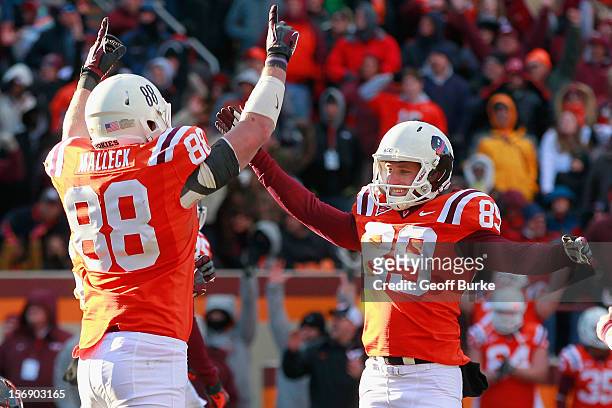 Kicker Cody Journell of the Virginia Tech Hokies celebrates with tight end Ryan Malleck of the Hokies after making the game-winning field goal on the...