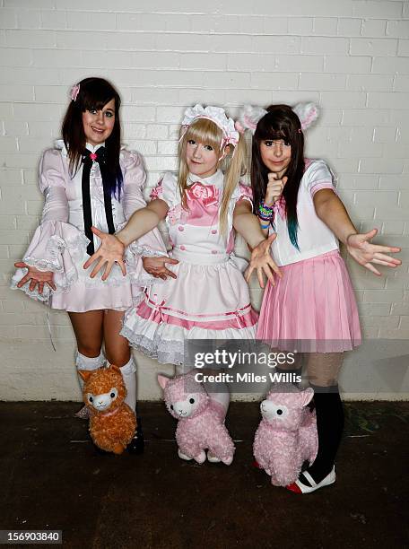 Beth Weal, Abi Pop and Jelly Neko from Sussex in 'Schoolgirl' fashion at Hyper Japan at Earl's Court on November 24, 2012 in London, England. Hyper...