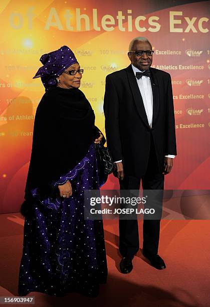 President Lamine Diack and his wife Bintou Diack arrive to attend the International Association of Athletics Federations gala on November 24, 2012 in...